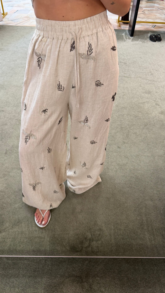 Pantaloni beige melange con ricami in paillettes glp