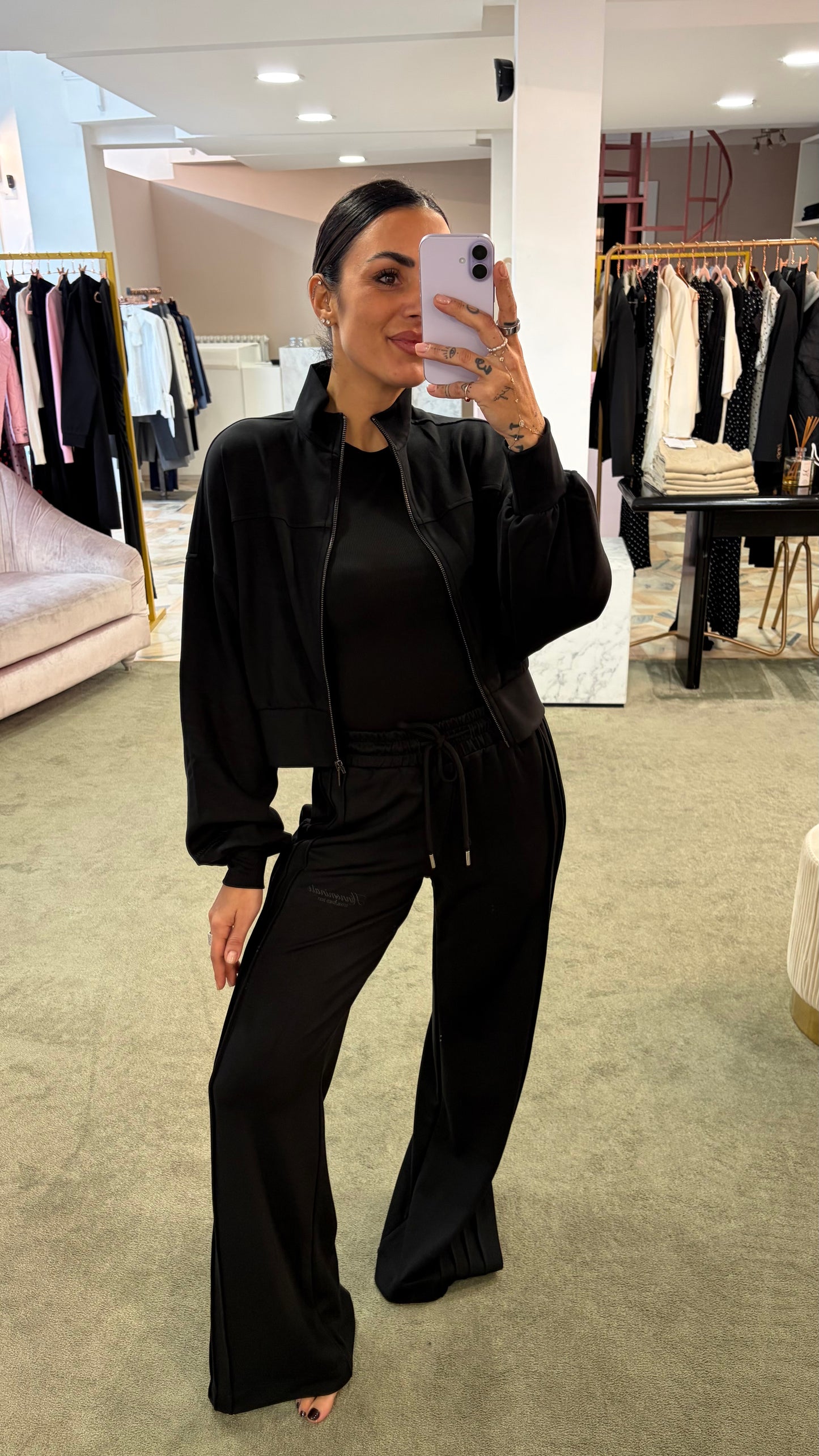 Joggers neri con spacchi laterali sul fondo Hinnominate