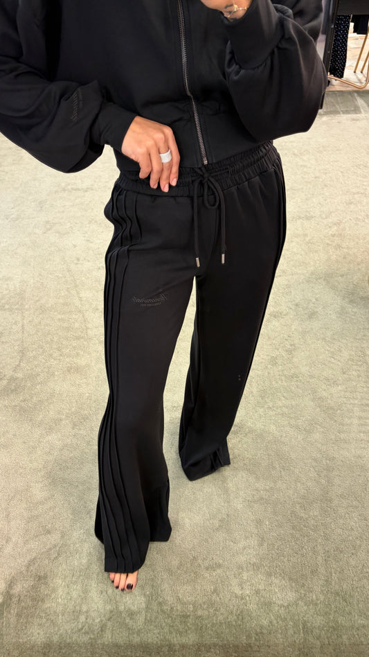 Joggers neri con spacchi laterali sul fondo Hinnominate